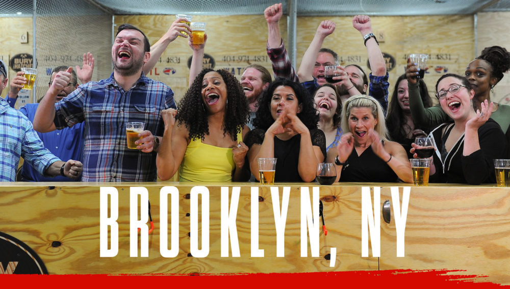 Bury The Hatchet Brooklyn NY City Page Header Image. Axe throwers celebrating with hands in air