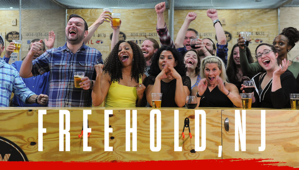 Bury The Hatchet Freehold NJ City Page Header Image. Axe throwers celebrating with hands in air